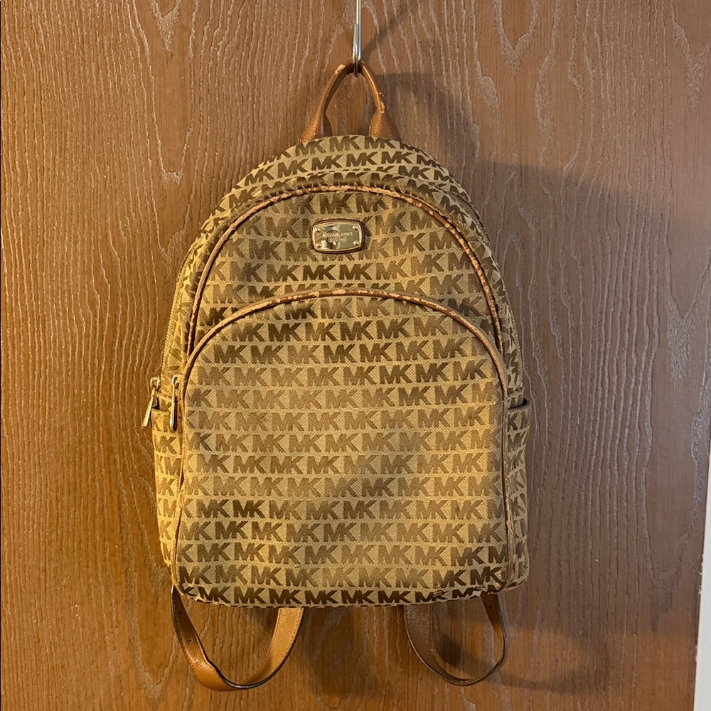 Michael Kors Tan Monogram Backpack with Gold Accents w/ Heavy wear. See pics